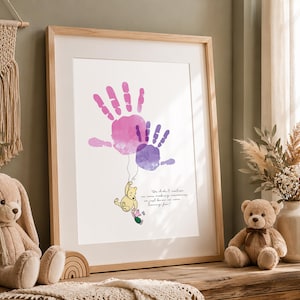 May include: Framed print featuring two handprints in pink and purple watercolor, connected by a string to Winnie the Pooh and Piglet. The quote reads, "We didn't realize we were making memories, we just knew we were having fun."