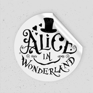 May include: A white round sticker with a black and white illustration of a top hat and the text "Alice in Wonderland".