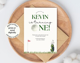 May include: A golf-themed invitation with the text "KEVIN is turning ONE!" in green. The invitation includes a golf ball graphic, a red flag, and a golf bag. The invitation is on a wooden plate with a brown envelope.