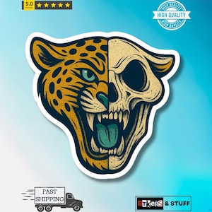 May include: A sticker featuring a split design: one half a jaguar's face, the other a skull. The jaguar side is yellow and black with green eyes, while the skull is beige. The sticker has a white border and a blue background.