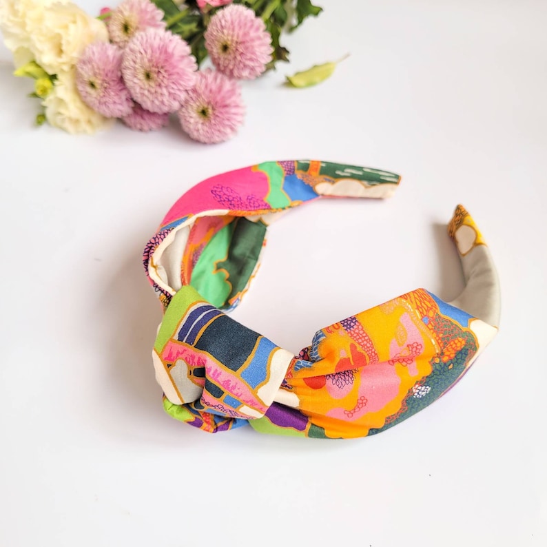 Multi coloured headband
Large pattern clouds and trees so each unique.Very colourful and funky.