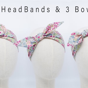 May include: Three headbands with a floral print in shades of pink, green, and white. The headbands are tied in a bow at the top. The text "2 Headbands & 3 Bows" is displayed above the headbands.