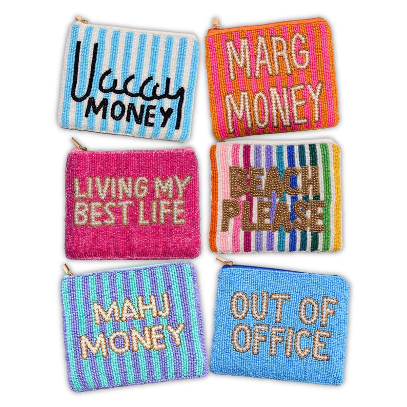 May include: Six beaded coin purses in various colors, each with a different phrase. Phrases include "Vacay Money," "Marg Money," "Living My Best Life," "Beach Please," "Mahj Money," and "Out of Office." Each purse has a zipper closure.
