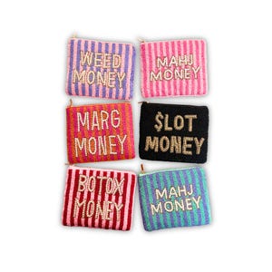 May include: A collection of six beaded coin purses in various colors, each with a different word or phrase spelled out in beads. The purses have a striped pattern and gold zippers. The phrases include "WEED MONEY", "MAHJ MONEY", "MARG MONEY", "$LOT MONEY", "BOTOX MONEY", and "MAHJ MONEY".