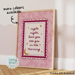 May include: A rectangular wall print in a light wooden frame featuring a pink background with a star pattern. The central design has a scalloped maroon border, a cream-colored center, and the text night night, love you see you in the morning.