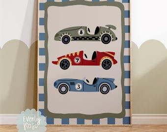 May include: A framed print featuring three vintage race cars in green, red, and blue. Each car has a different number: 8, 7, and 3. The print has a blue and white checkered border and the text "Everly Rose Prints". The phrase "*Frame not included" is also present.