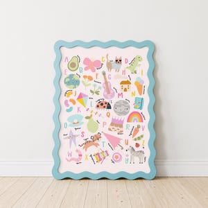 May include: A colorful alphabet chart with illustrations of various objects and animals for each letter. The chart is framed in a light blue frame with a wavy edge.