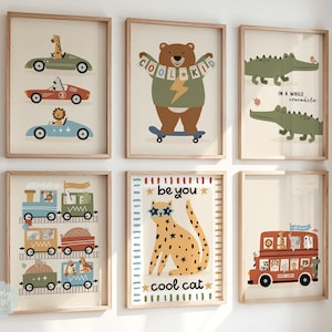 May include: Set of 6 colourful framed prints featuring illustrations of animals and vehicles. The prints include a lion driving a blue car, a bear on a skateboard, a crocodile, a train with animals, a cat wearing sunglasses, and a double-decker bus with animals.