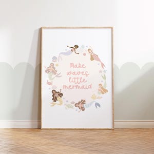 May include: A pink and white printable art print with a circle of mermaids and the text "Make waves little mermaid".