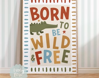 May include: A beige poster with a green alligator illustration and the text "Born to be Wild & Free" in colorful letters. The poster has a brown wood frame.