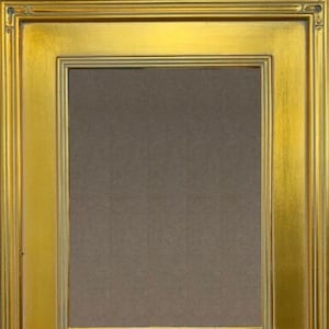 May include: A gold picture frame with a simple, ornate design. The frame has a matte finish and a slightly raised lip around the opening.