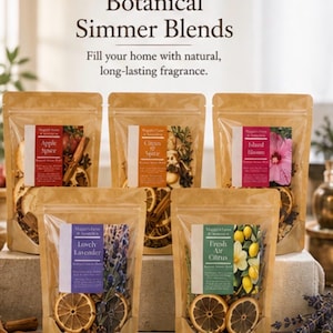 May include: Five clear pouches of Botanical Simmer Blends, each with a different fragrance. The pouches are filled with dried botanicals and spices, including apple, citrus, lavender, and hibiscus. The text on the pouches reads "Fill your home with natural, long-lasting fragrance."