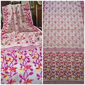 May include: White saree with a pink and orange floral pattern. The saree has a thin white border with a pink floral design.