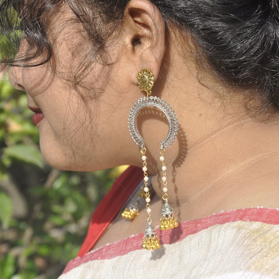 Elegant woman in traditional Indian clothes near rocky wall · Free Stock  Photo