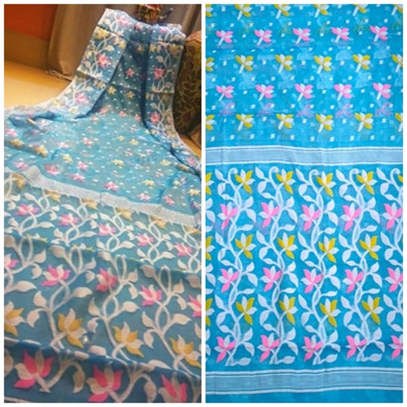 May include: A blue and white patterned saree with a floral design. The saree has a light blue base with white floral vines and pink flowers.