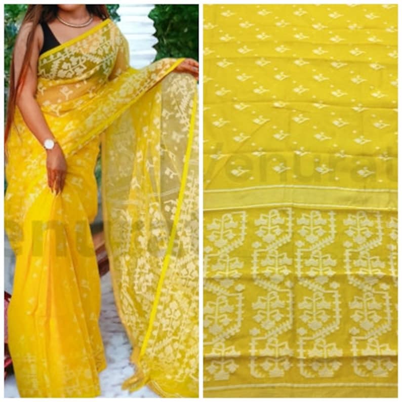 May include: A yellow saree with a white floral pattern. The saree is sheer and has a delicate texture.