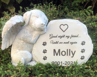 May include: A white stone pet memorial featuring a sleeping puppy with angel wings, resting against a stone with the name "Molly", paw prints, and the text "Good night my friend... Until we meet again". The memorial has the years 2001-2021.