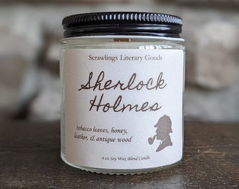 May include: A 4 ounce soy wax blend candle in a clear glass jar with a black lid. The label is white with brown text that reads "Scrawlings Literary Goods", "Sherlock Holmes", "tobacco leaves, honey, leather, & antique wood", and "4 oz Soy Wax Blend Candle". A silhouette of Sherlock Holmes with a pipe is also on the label.