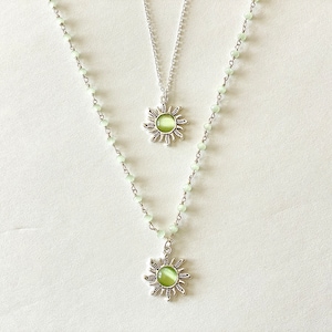 silver & green sun necklace, green rosary chain, indie sun pendant, green crystal necklace, trendy y2k jewelry, silver sun pendant