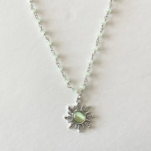 silver & green sun necklace, green rosary chain, indie sun pendant, green crystal necklace, trendy y2k jewelry, silver sun pendant
