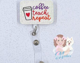 May include: White glitter badge holder with a clear plastic strap. The badge holder has a white background with a black and white coffee cup with a red heart. The text "coffee teach repeat" is written in purple and orange.