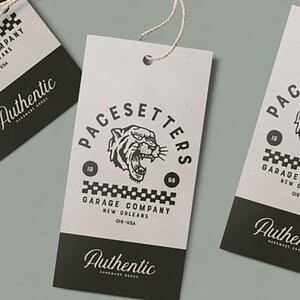 May include: Three black and white paper tags with a tiger head logo and the text "PACESETTERS GARAGE COMPANY NEW ORLEANS 08 19" and "Authentic" at the bottom.