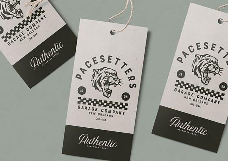 May include: Three black and white paper tags with a tiger head logo and the text "PACESETTERS GARAGE COMPANY NEW ORLEANS 08 19" and "Authentic" at the bottom.