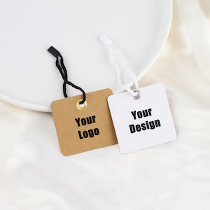 May include: Two square gift tags with string attached. One tag is brown with the text "Your Logo" and the other is white with the text "Your Design".