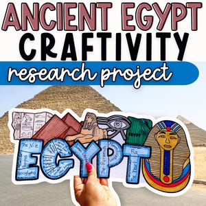May include: An Ancient Egypt Craftivity research project image. The image features the words "Ancient Egypt Craftivity research project" in a stylized font. A hand holds a colorful cutout of the word "Egypt" with illustrations of pyramids, hieroglyphs, and pharaohs.