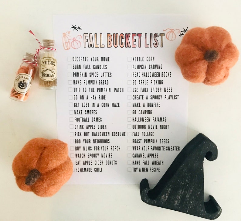 May include: A printable checklist with a white background and black text. The checklist is titled "Fall Bucket List" and includes activities such as "Decorate your home", "Burn fall candles", "Pumpkin carving", "Read Halloween books", "Go apple picking", "Use faux spider webs", "Create a spooky playlist", "Make a bonfire", "Go camping", "Halloween pajamas", "Outdoor movie night", "Fall foliage", "Roast pumpkin seeds", "Wear your favorite sweater", "Caramel apples", "Hang fall wreath", "Try a new recipe".