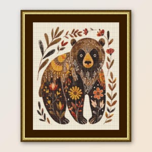 May include: A brown bear with a floral pattern on its fur, surrounded by leaves and flowers. The bear is standing on a white background.