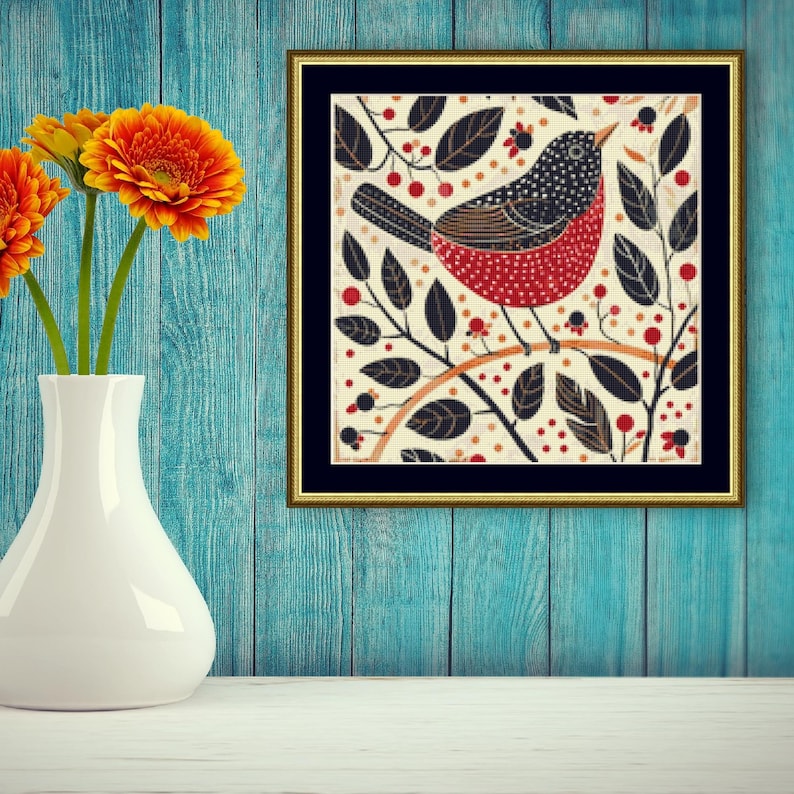 May include: A framed illustration of a red and black bird perched on a branch with black leaves and red berries. The background is a cream color with a black frame.