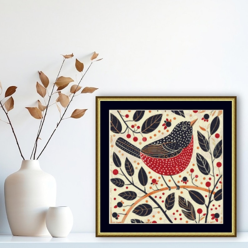 May include: A framed illustration of a red and black bird with white polka dots perched on a branch with black leaves and red berries.