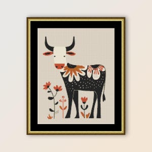 May include: A black and white cow with orange flowers around its neck stands in a field of orange flowers. The cow is stylized and has a simple design.