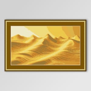 May include: A framed cross-stitch landscape depicts a desert scene with rolling sand dunes in shades of yellow and gold. The artwork is encased in a gold-colored frame, creating a warm and inviting aesthetic. The piece evokes a sense of tranquility and natural beauty.