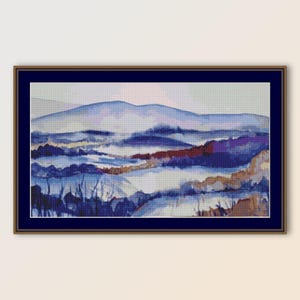 May include: A framed abstract painting of a landscape with blue, purple, and brown hues. The painting depicts a distant mountain range with rolling hills and valleys in the foreground.