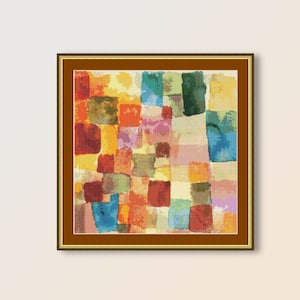 May include: Abstract painting with a grid of colorful squares in shades of red, orange, yellow, green, blue, and purple. The painting is framed in a brown wood frame.