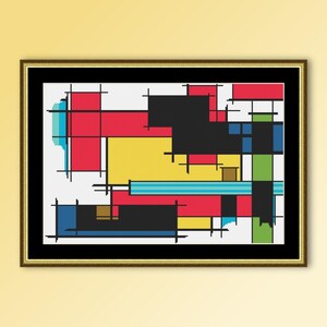 May include: Framed abstract cross-stitch art featuring a geometric design. The artwork uses a palette of red, yellow, black, blue, and green blocks on a white background. The piece is framed in a gold frame with a black border.