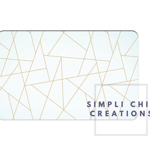 May include: A white gift card with a geometric pattern of gold lines. The text "SIMPLI CHIC CREATIONS" is printed in the bottom right corner.