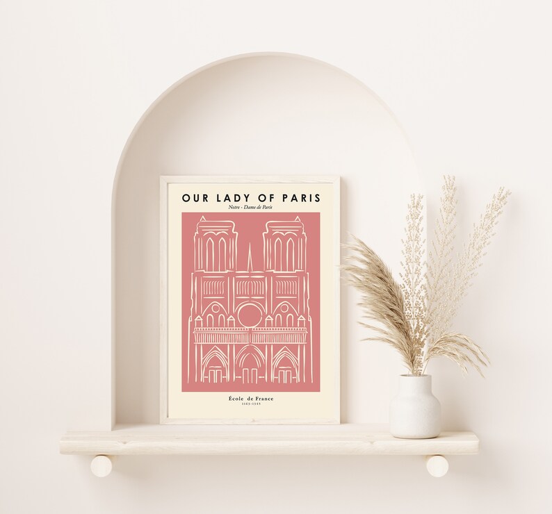 May include: A pink and white printable art print with a line drawing of the Notre Dame Cathedral in Paris, France. The text "Our Lady of Paris" is at the top of the print, and the text "Notre Dame de Paris" is below the drawing. The text "Ecole de France 1163-1345" is at the bottom of the print.