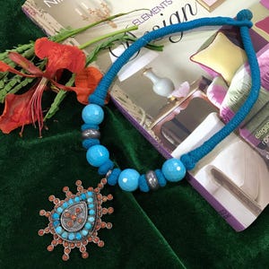 A Turquoise beads Necklace with silver beads and silver Pendant with natural coral and Turquoise And Thread Necklace = 75.5 Grams Beads 16mm