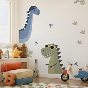 May include: Wall decals of two cartoon dinosaurs, one blue wearing a cap and the other green with sunglasses. The room has a child's scooter, a star-shaped pillow, and a small guitar. Decorative dragonflies and footprints are also on the wall.