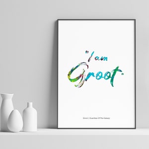 May include: A white framed print with a colorful, hand-painted quote that reads "I am Groot." The quote is in a blue, green, and yellow color scheme. The print also includes the text "Groot | Guardian of the Galaxy."