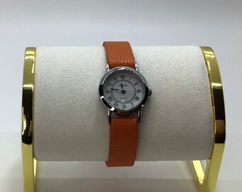 Vintage Bay Studio Lady’s Silver tone Watch with Faux Orange Leather Band