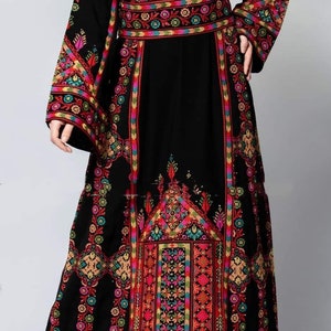 An Embroidered Dress With Heavy Hand Embroidery, A Mix Of Colors With A Black Base, Luxurious Palestinian Design Handmade In Jordan