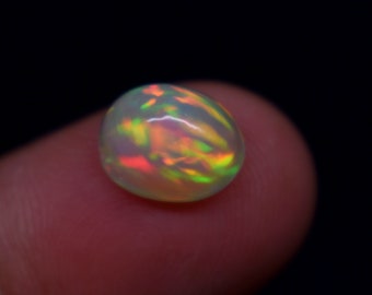 2.20 Carat Flashy Fire Natural Ethiopian Opal Gemstone Oval Shape Cabochon, Opal Gemstone Size 10.1X8X5.7 MM.
