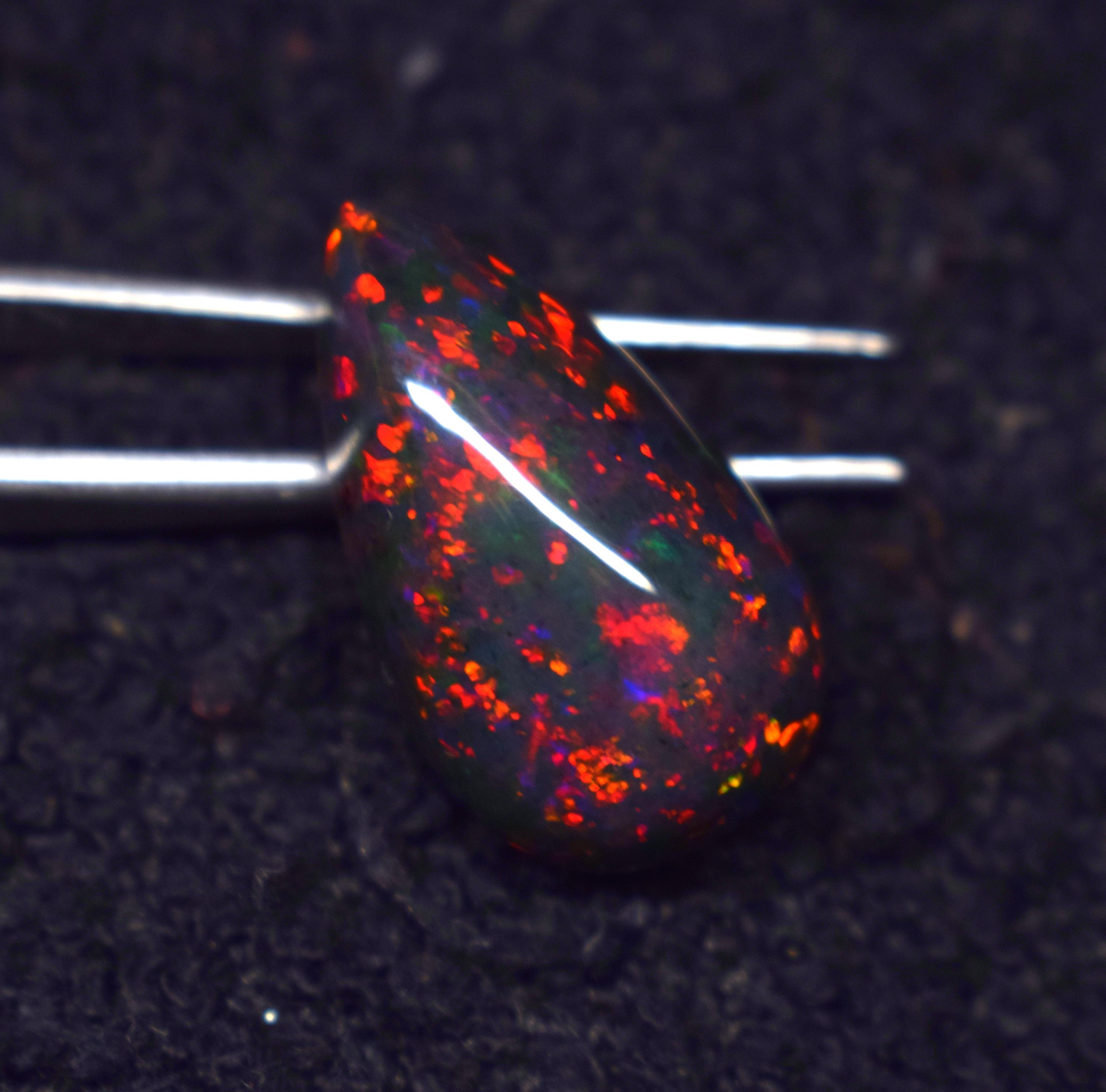 9.1 Carat Ethiopian Black Opal Cabochon: Rainbow Fire Gemstone