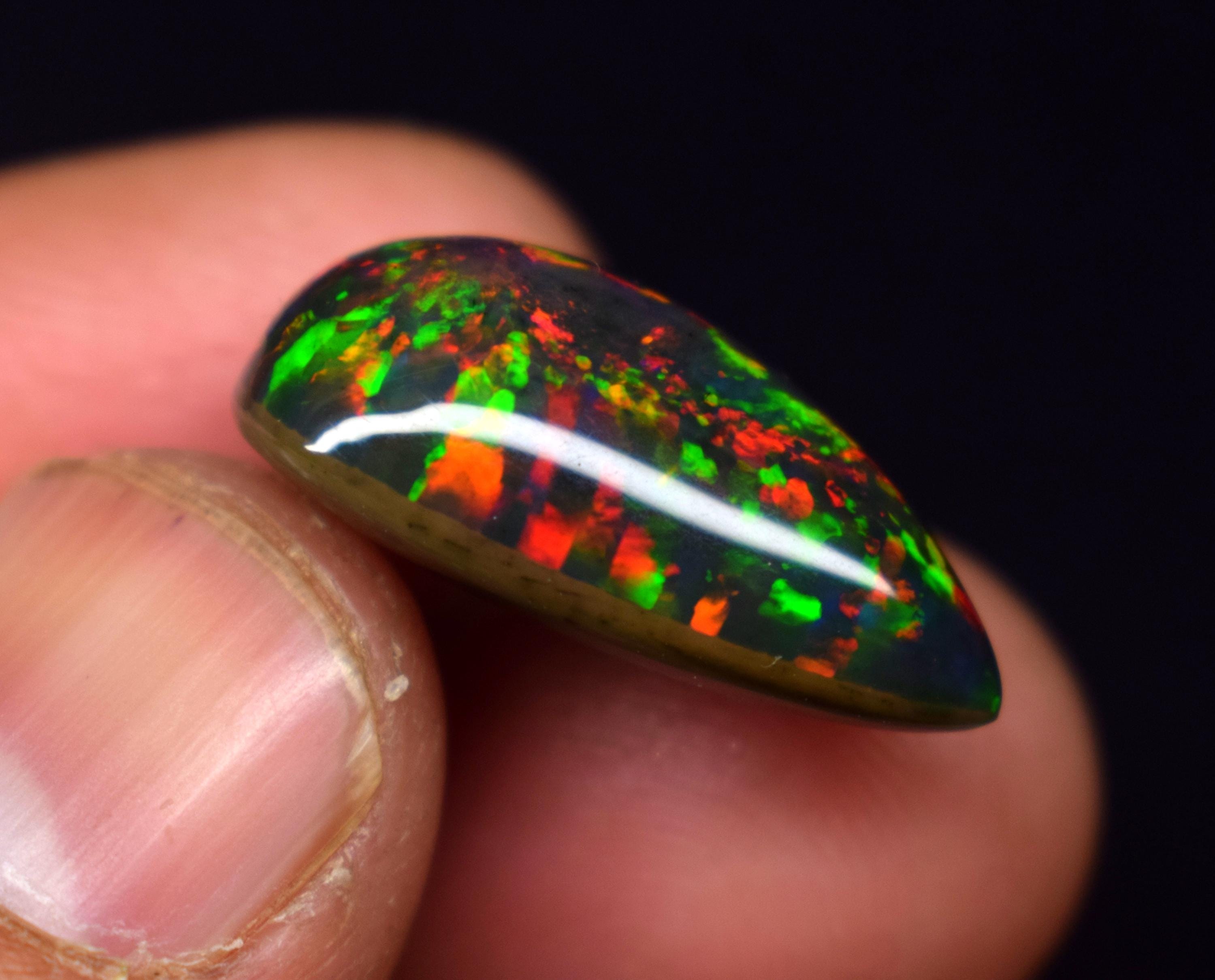 9.1 Carat Ethiopian Black Opal Cabochon: Rainbow Fire Gemstone
