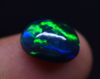 Natural Ethiopian 3.4 Carat Multi Fire, Size 12.4x9.4x6 MM, Black Smoked Opal Oval Shape Cabochon Gemstone,  For Making Jewelry.