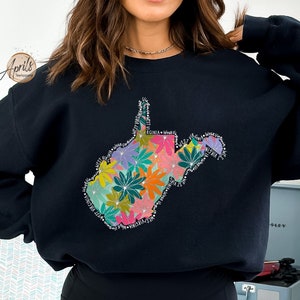 May include: Black sweatshirt with a floral design of the state of West Virginia.